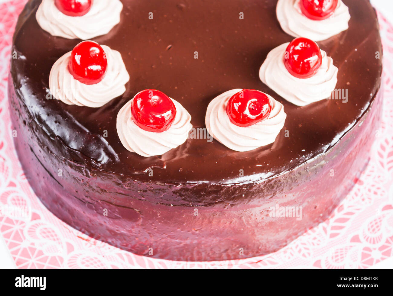 Home made chocolate cake with cherry and whipped cream Stock Photo - Alamy