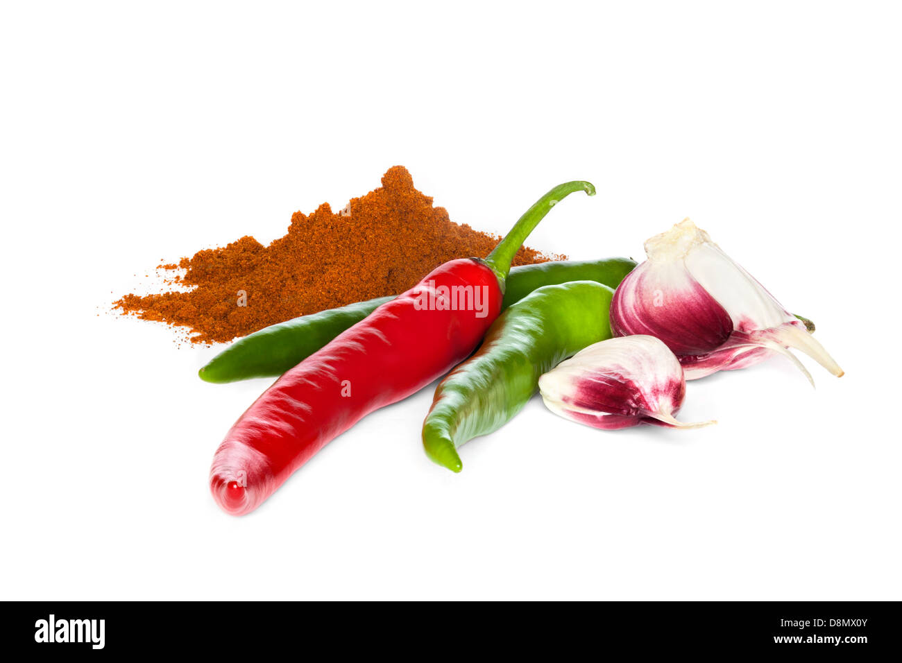 Spanish seasoning of chilli, garlic and paprika on a white background with soft natural shadow. Front to back focus. Stock Photo