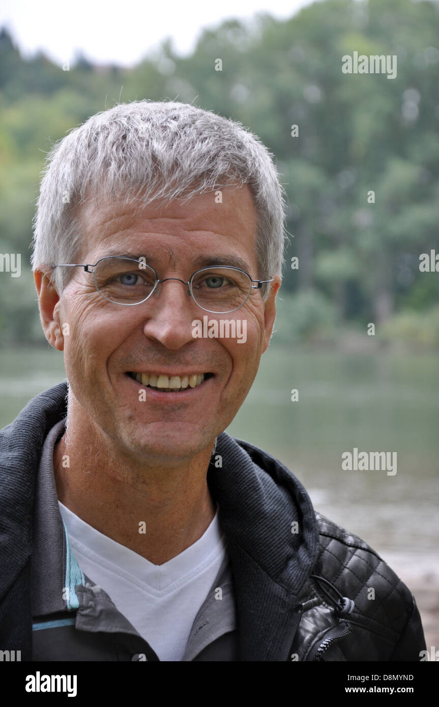 man with glases smiles Stock Photo
