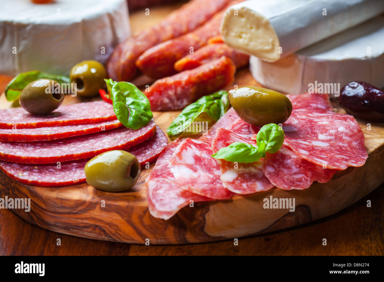 Salami and cheese platter with vegetable and herbs Stock Photo Alamy