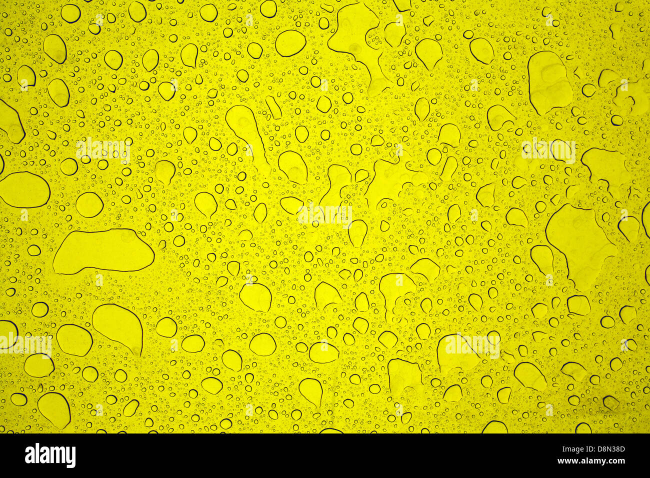 Water drops on a yellow background Stock Photo - Alamy
