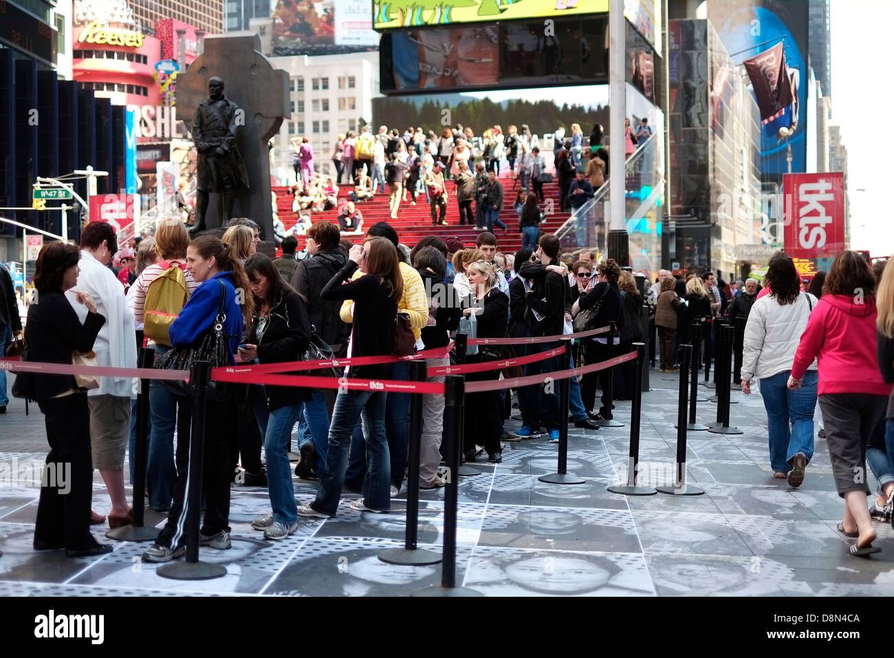 Customers line up at the TKTS booth in Times Square, Manhattan to purchase theatre tickets for Broadway shows. Stock Photo