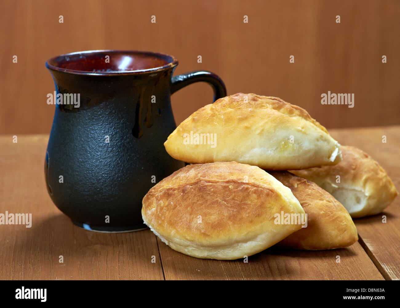 russia traditions pierogi .Home cake with cabbage against the wooden table Stock Photo