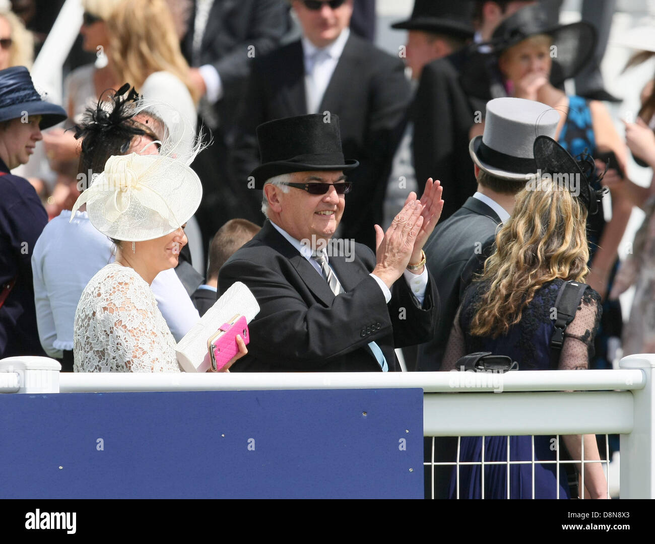 Epsom Downs, Surrey, UK. 1st June 2013.  A spectator applauds as The Queen and Prince Phillip arrive at the course on The Investec Derby Day from Epsom Racecourse. Credit:  Action Plus Sports Images/Alamy Live News Stock Photo