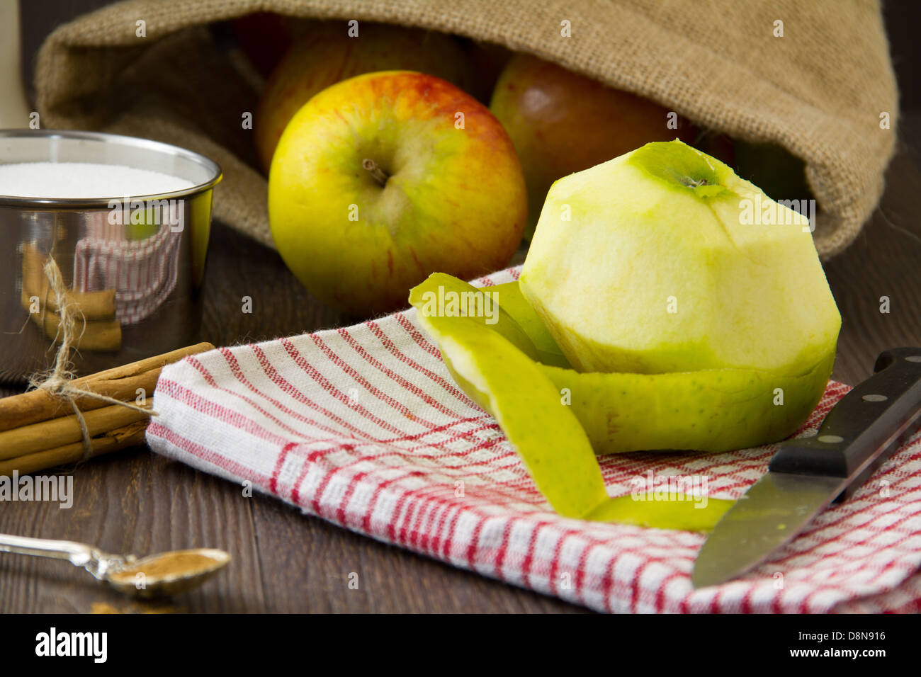 Peeled apple with ingredients for an apple pie Stock Photo Alamy