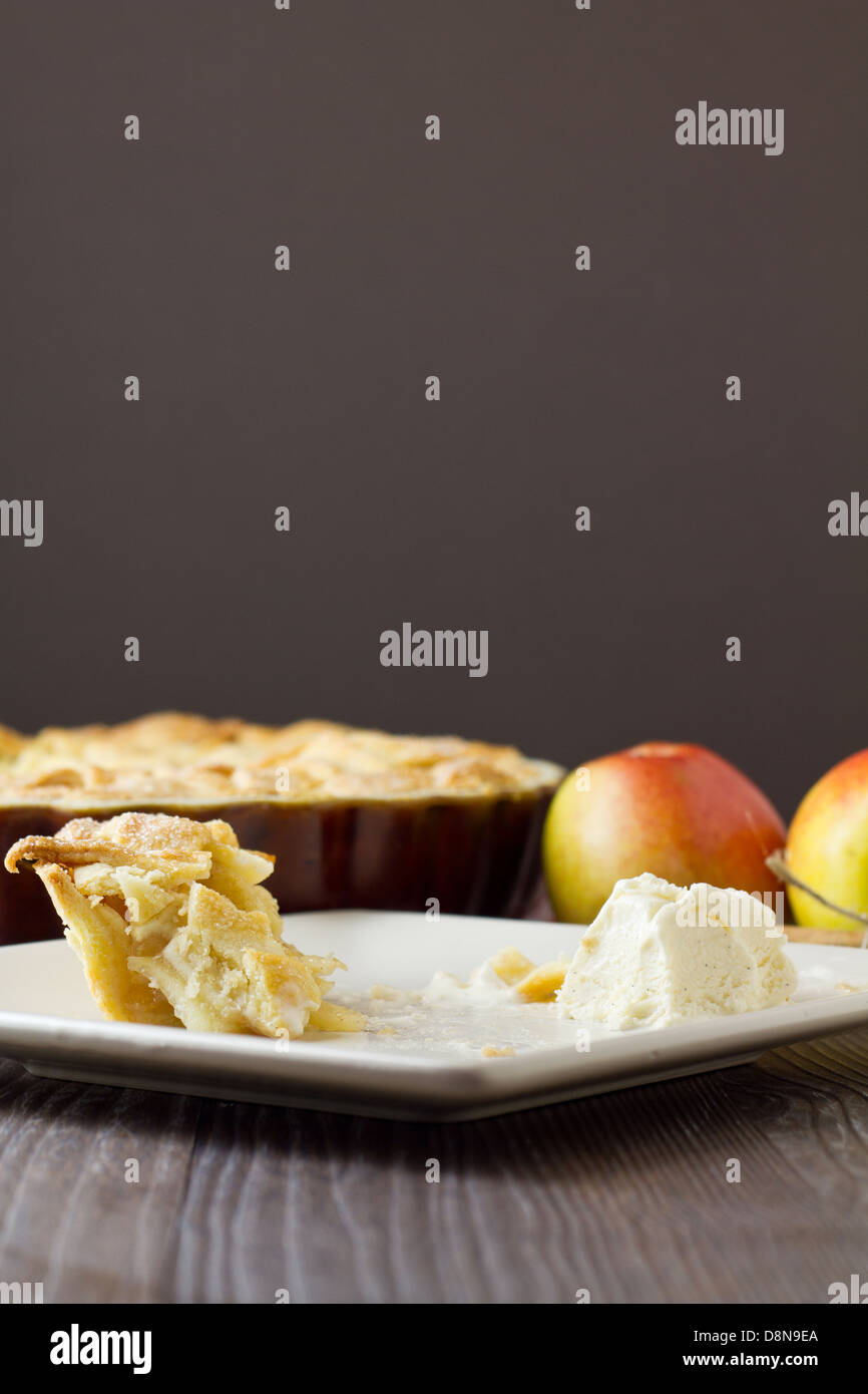 Half eaten slice of apple pie a la mode, vertical Stock Photo Alamy