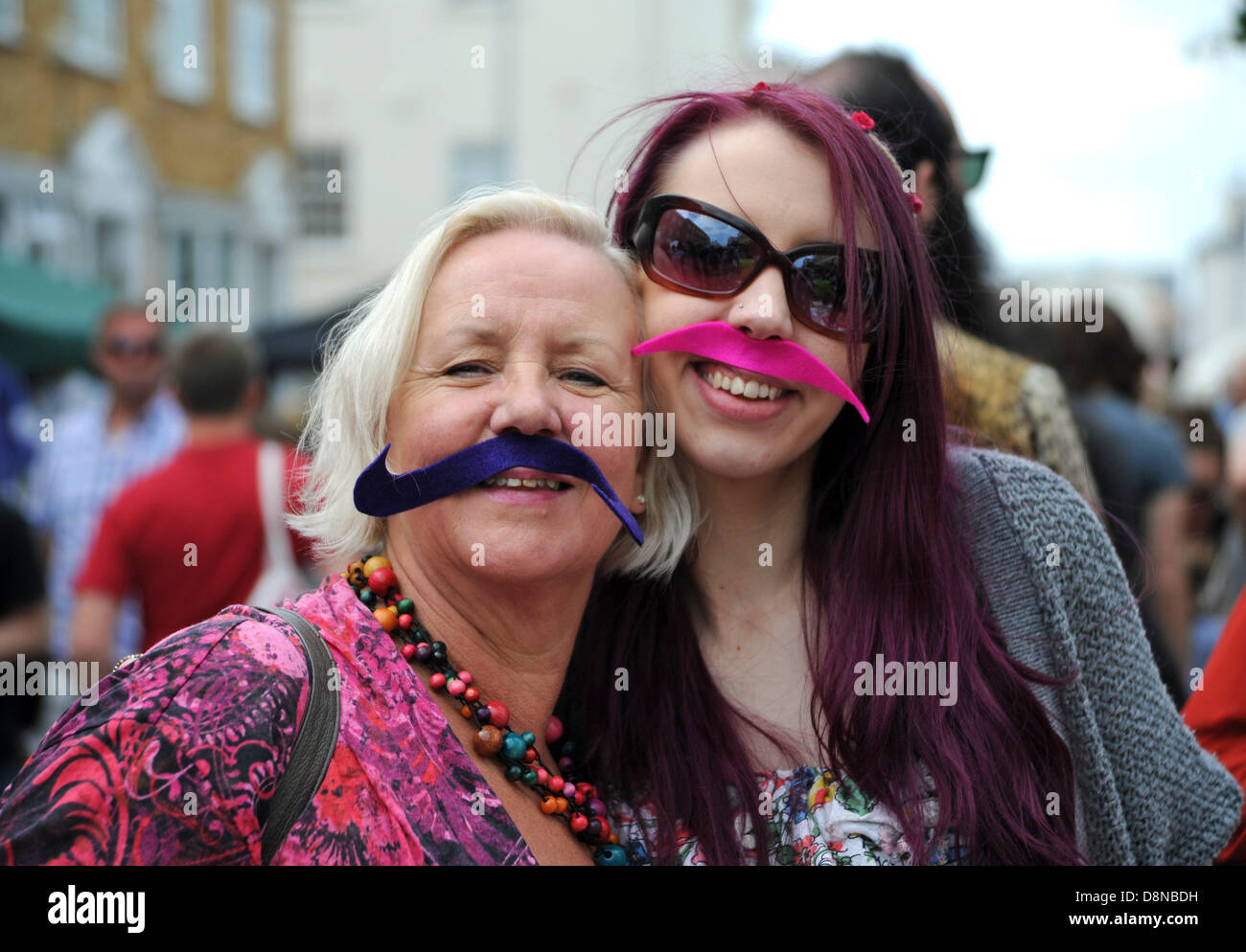 Woman wearing fake moustache hi-res stock photography and images - Alamy