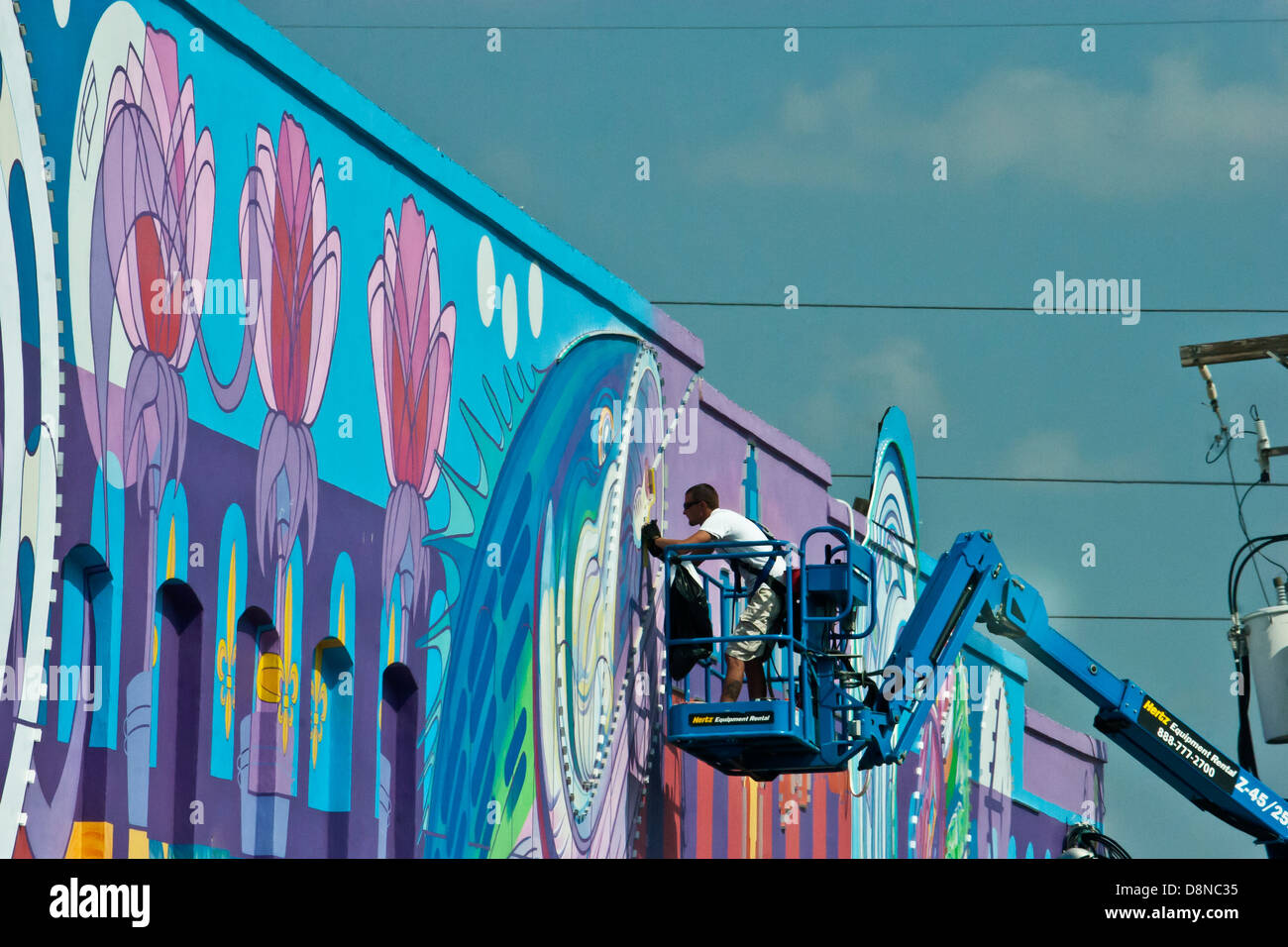 Man painting wall art downtown Shreveport, Louisiana USA Stock Photo