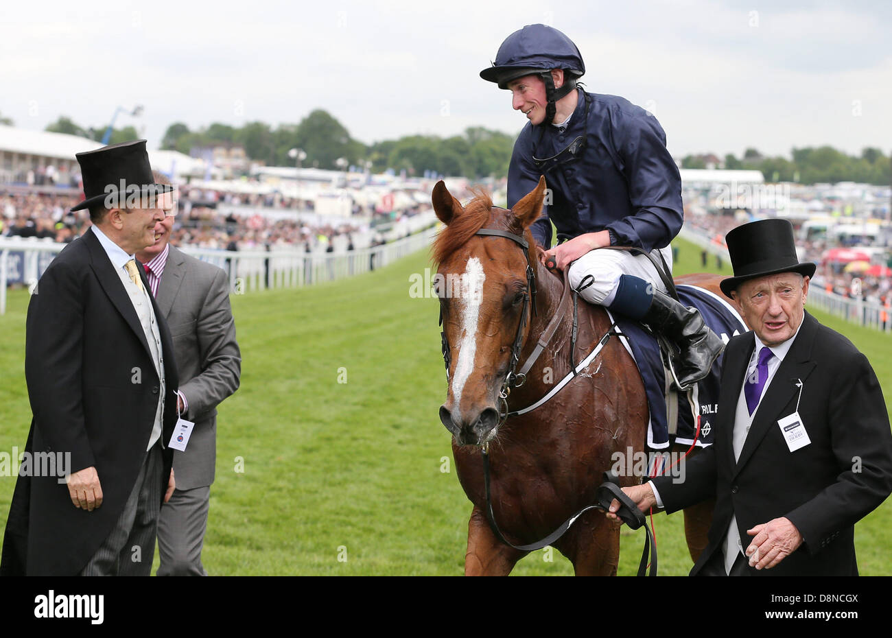 Epsom Downs, Surrey, UK. 1st June 2013.  Ryan Moore smiles as he is led in after riding Ruler of the World to win The Derby on The Investec Derby Day from Epsom Racecourse. Credit:  Action Plus Sports Images/Alamy Live News Stock Photo