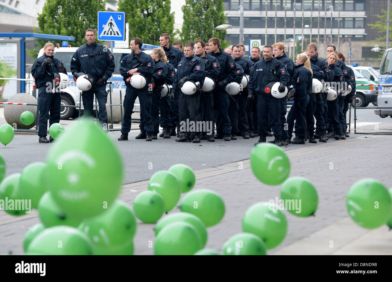 Wolfsburg, Germany. 1st June 2013. Balloons with inscriptions 'Nazis? Nein Danke' lie in front of police officers on the street in Wolfsburg, Germany, 01 June 2013. Police expects 500 to 700 participants in the neonazi demonstration today. PHOTO: PETER STEFFEN/dpa/Alamy Live News Stock Photo