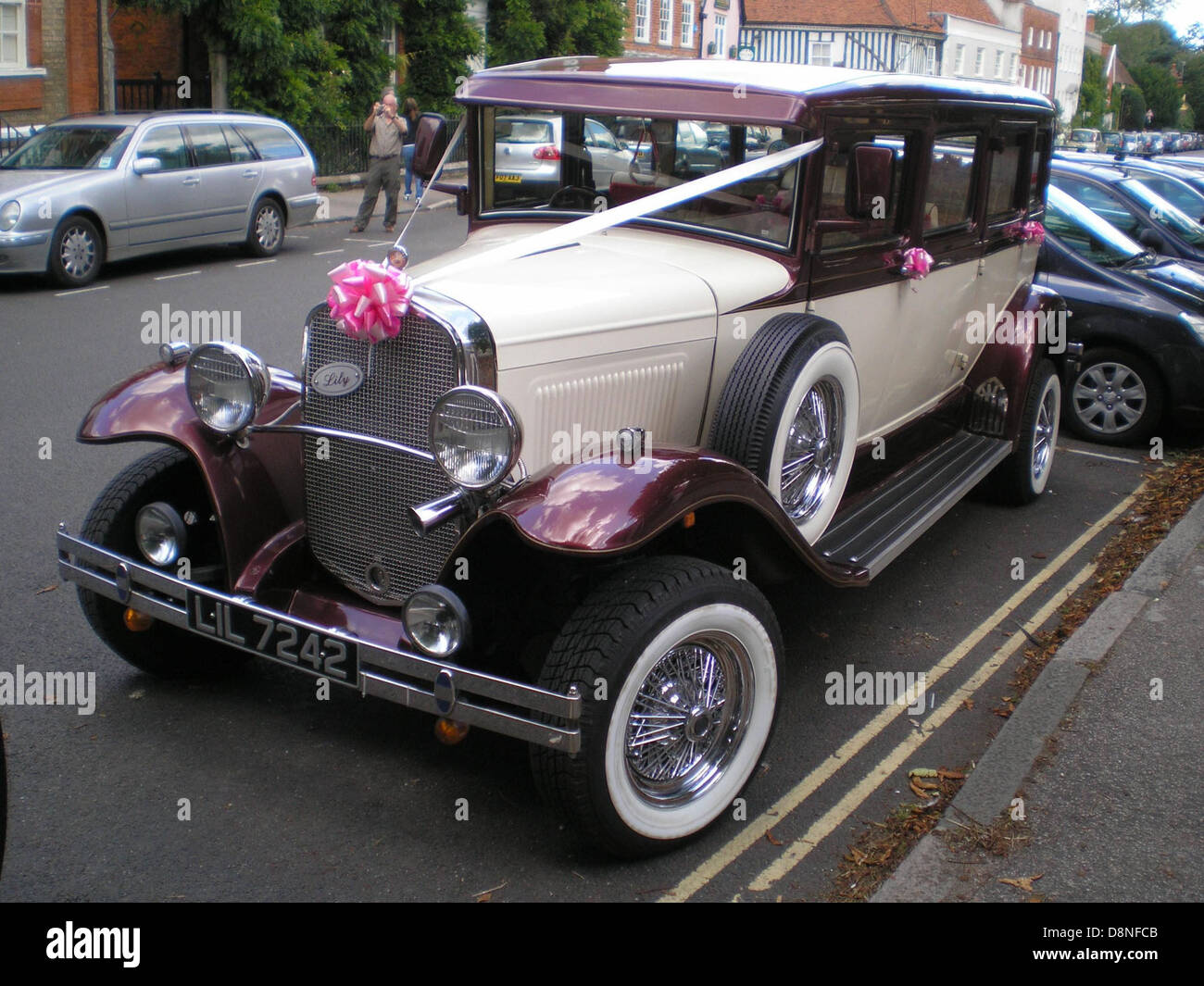 This image shows a vintage wedding car, often referred to as an ...