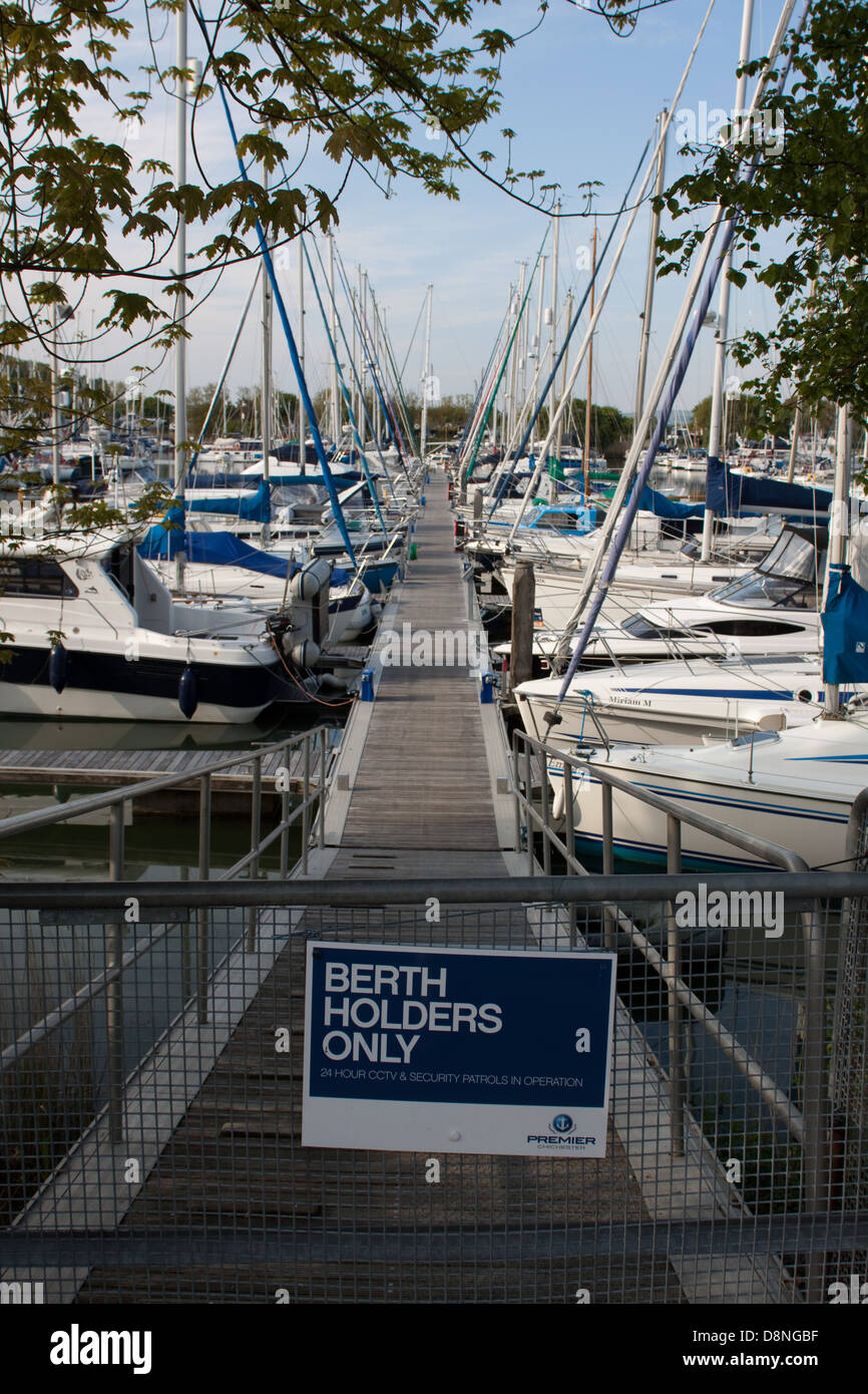 Boats moored along a pontoon at Chichester Marina, West Sussex Stock Photo Alamy