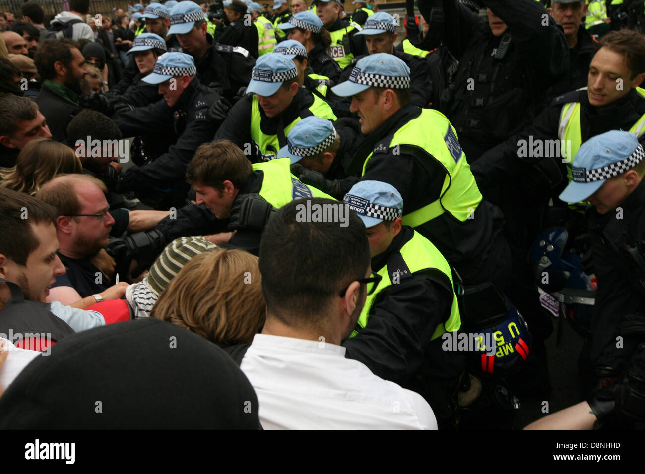 London, UK. 1st June, 2013. Scuffles between anti-fascist protesters and police after a BNP march was stopped. The protesters were trying to get to the BNP section behind the police.  Credit:  Mario Mitsis / Alamy Live News Stock Photo