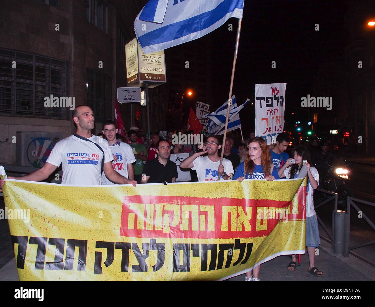 Jerusalem, Israel. 1st June, 2013. A few dozen protesters march to Kikar Paris Square near PM Netanyahu's residence demanding social justice and calling on Netanyahu to resign, triggered by a VAT increase to 18 percent due at midnight. Jerusalem, Israel. 1-June-2013.  Nationwide protests demand comprehensive change in government priorities taking place in Jerusalem, Tel-Aviv, Haifa and Beersheba. Credit:  Nir Alon/Alamy Live News Stock Photo