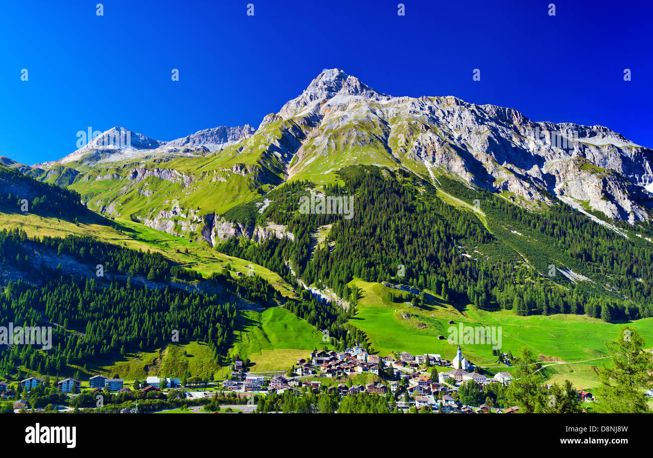 Alps mountains and town summer landscape Stock Photo - Alamy