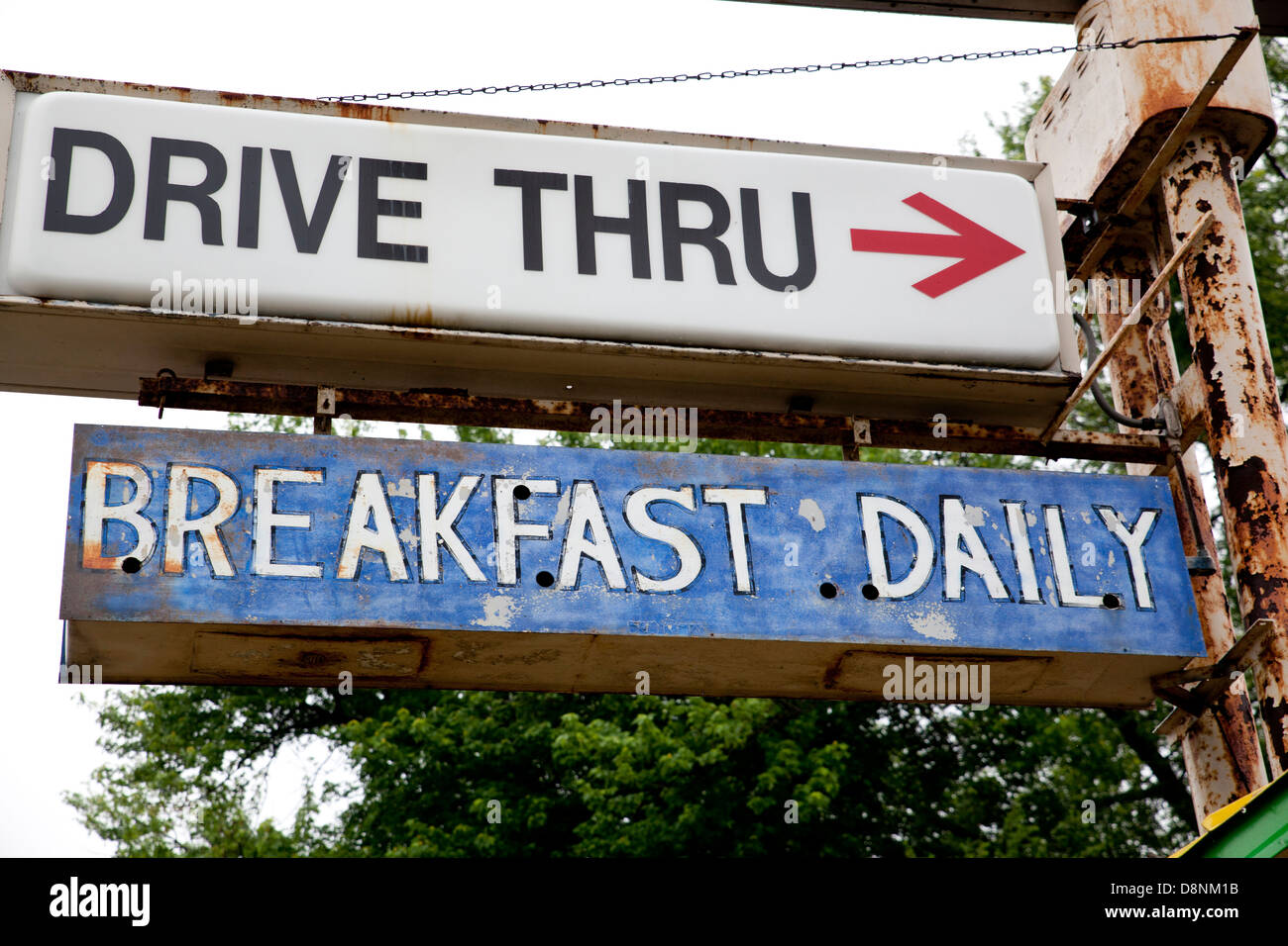 Close-up of vintage 'drive-thru' and 'breakfast daily' signs. Stock Photo