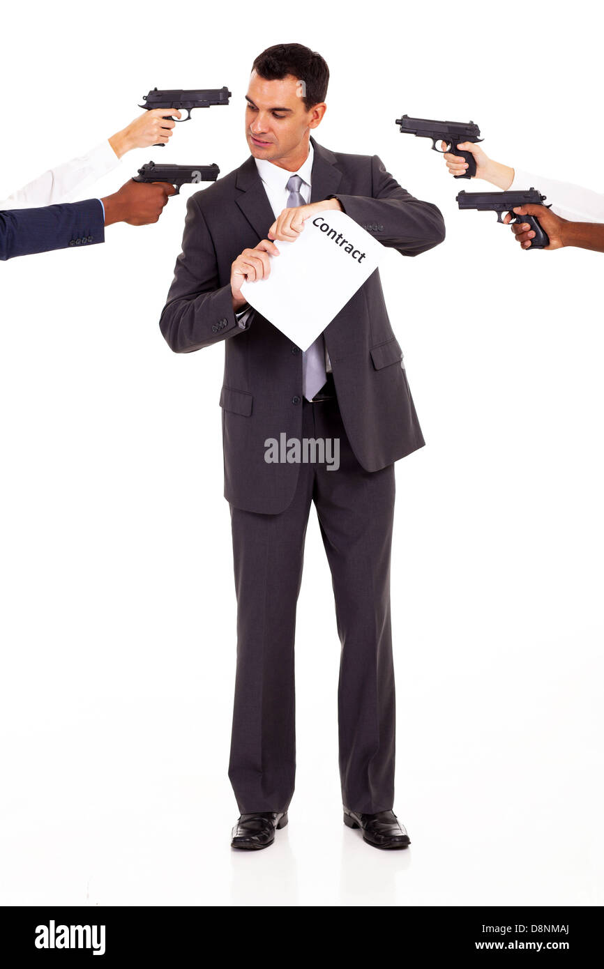 businessman being attacked at gun point when breaking contract Stock Photo