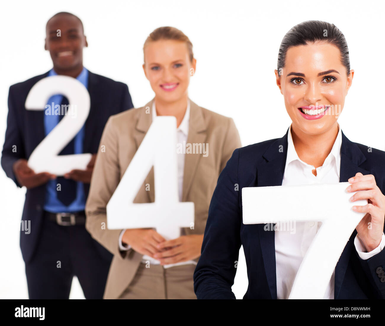 group of business people holding numbers 24 7 Stock Photo