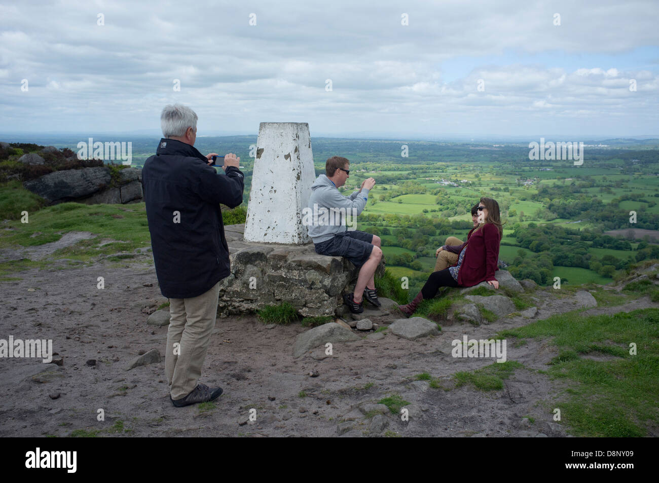 A family stops to take photographs on Bosley Cloud, on the Staffordshire Way in England. Stock Photo