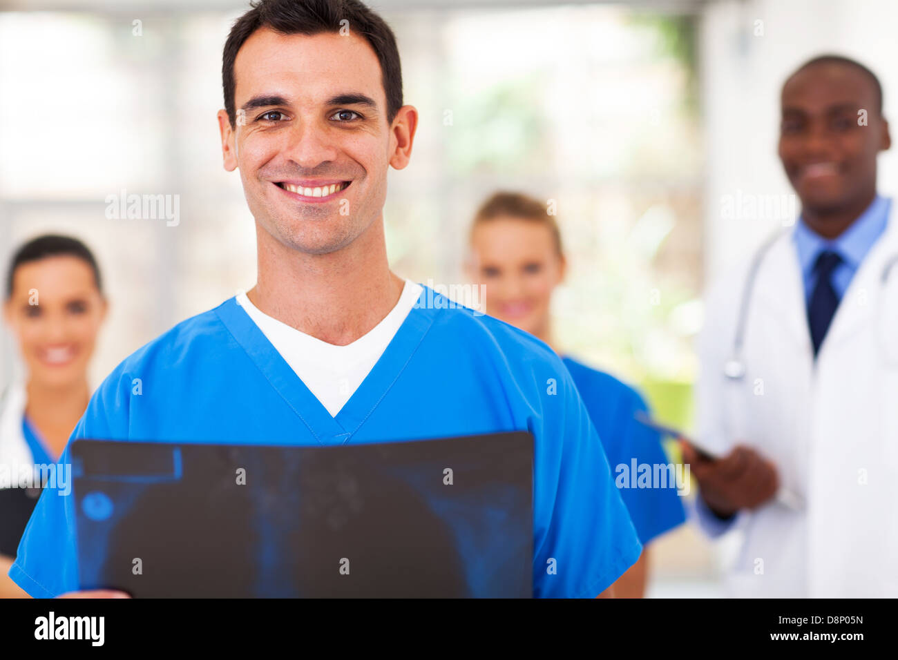handsome medical doctor and team in hospital Stock Photo