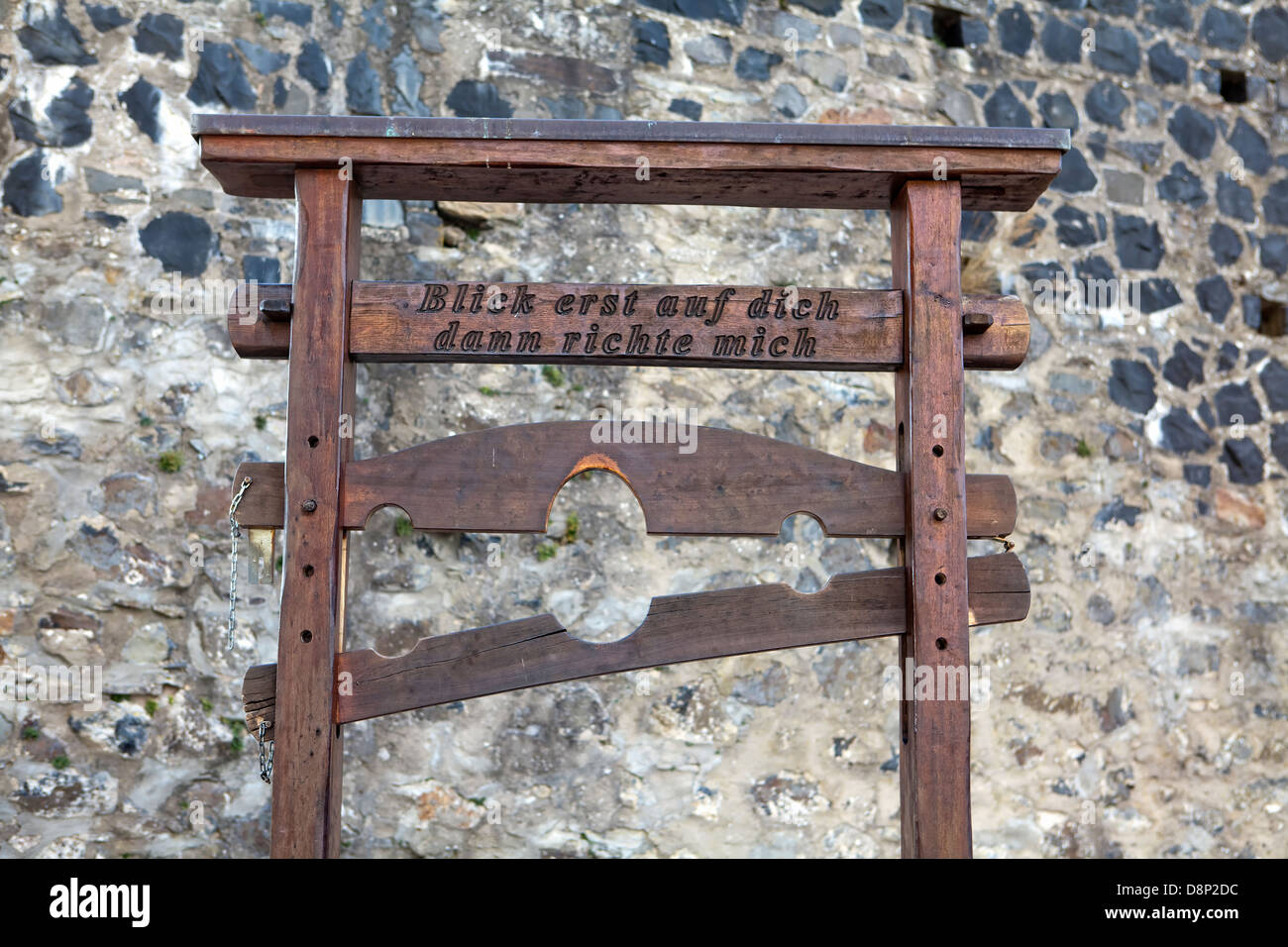 Pillory from the Middle Ages with the inscription 'look at yourself first, then judge me', Burg Greifenstein Castle, Germany, Eu Stock Photo