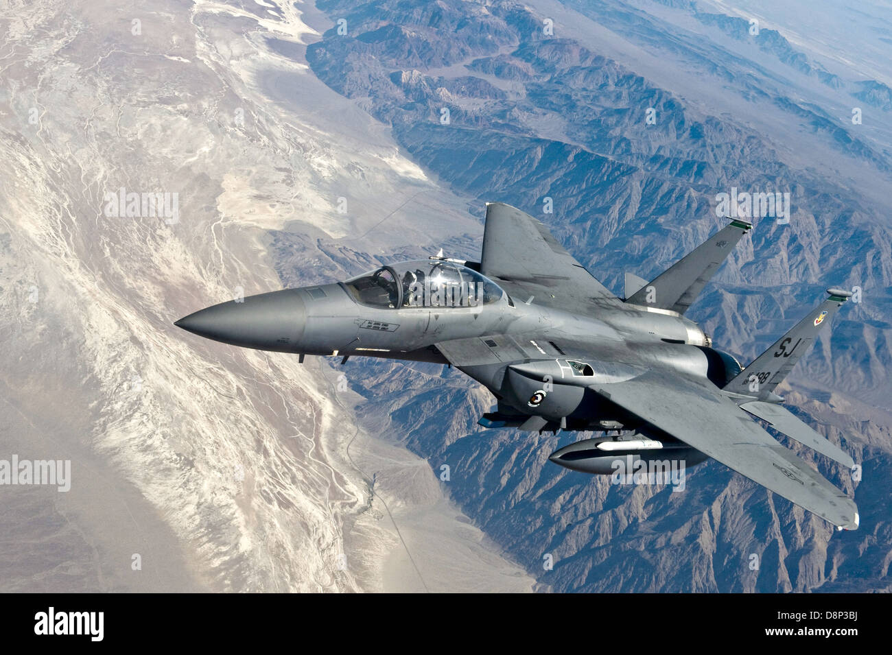 US Air Force F-15E Strike Eagle fighter aircraft flies over the desert June 22, 2011 at Fort Irwin, CA. Stock Photo
