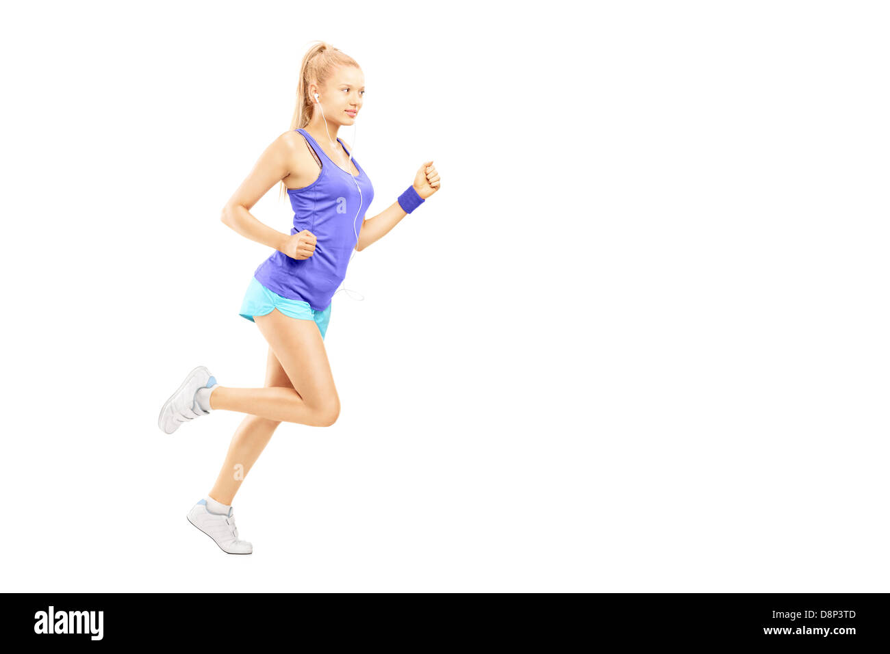 Full length portrait of a young female running isolated on white background Stock Photo