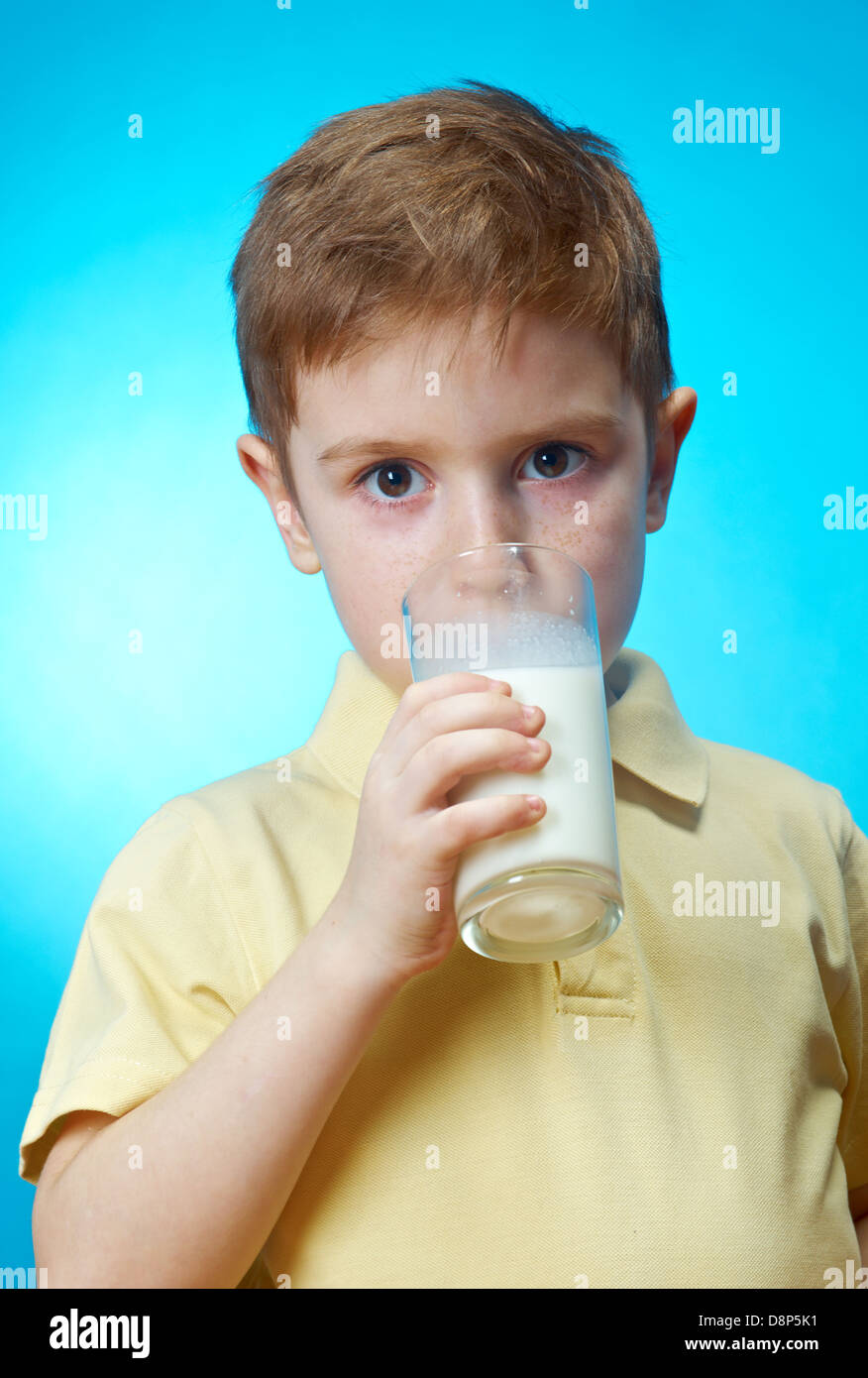 little boy eats homemade pie and glass of milk Stock Photo Alamy