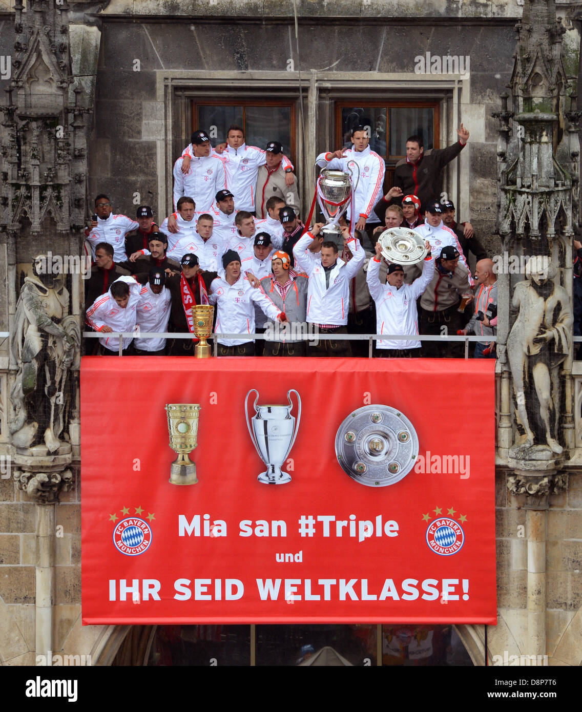 Munich, Germany. 2nd June, 2013. Bayern's players celebrate on the balcony of the town hall in Munich, Germany, 02 June 2013. FC Bayern Munich wins German Championship, Champions League and DFB Cup for the season 2012/13. PHOTO: PETER KNEFFEL/dpa/Alamy Live News Stock Photo