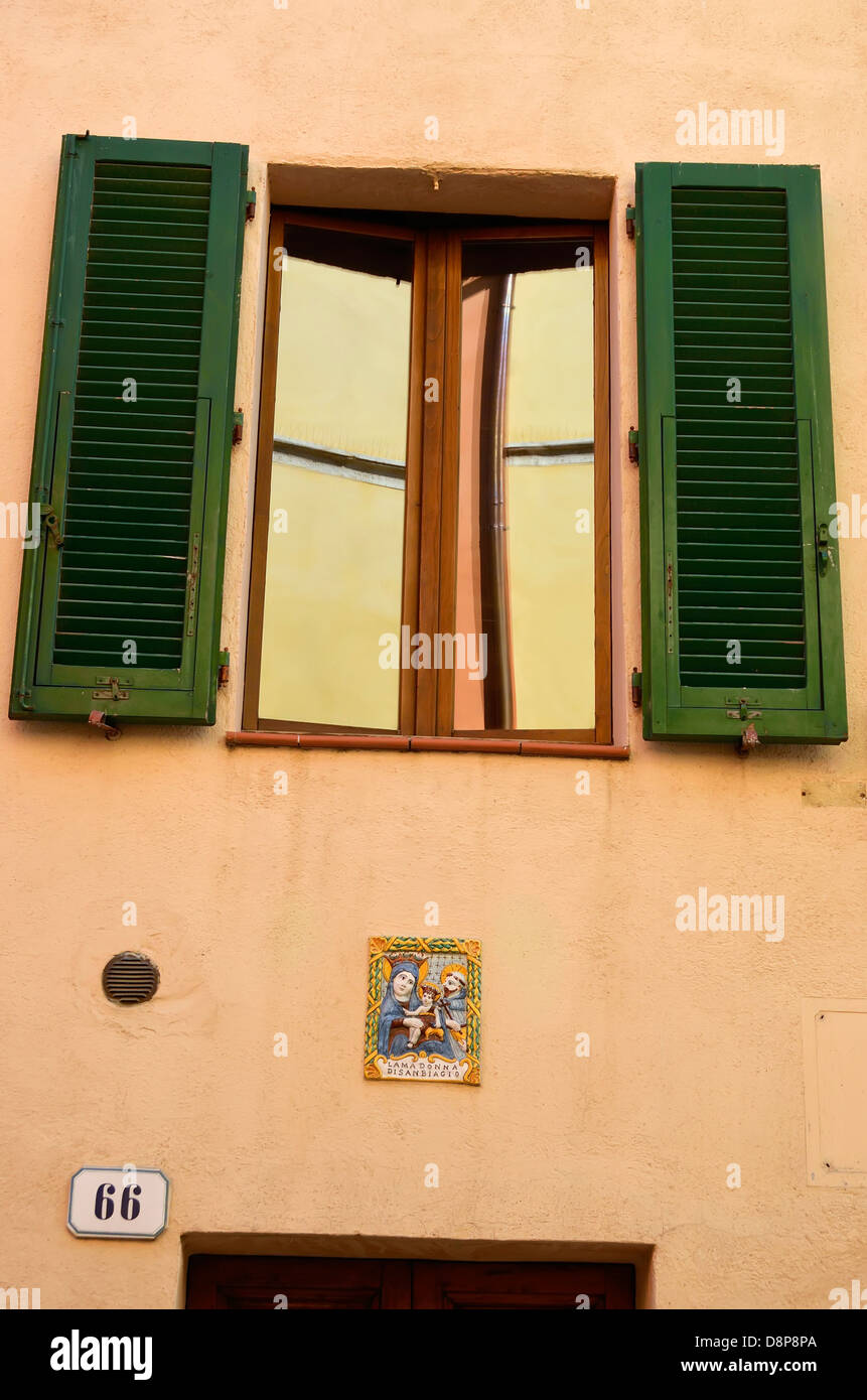 Facade of a building in San Quirico d'Orcia, Italy. Stock Photo