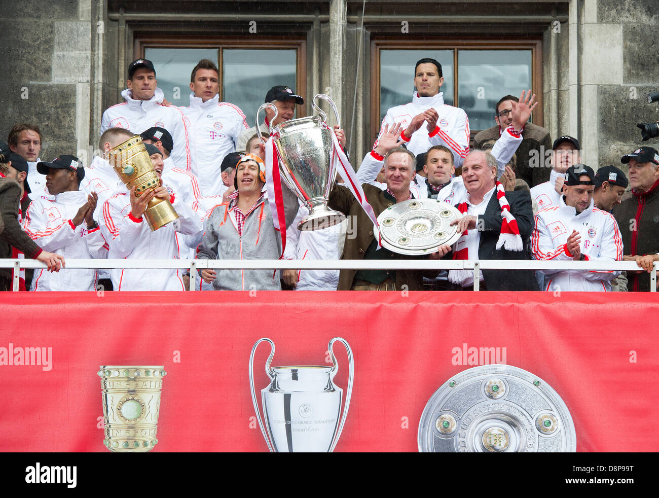 Munich, Germany. 2nd June, 2013. Bayern's players celebrate on the balcony of the town hall in Munich, Germany, 02 June 2013. FC Bayern Munich wins German Championship, Champions League and DFB Cup for the season 2012/13. PHOTO: MARC MUELLER/dpa/Alamy Live News Stock Photo