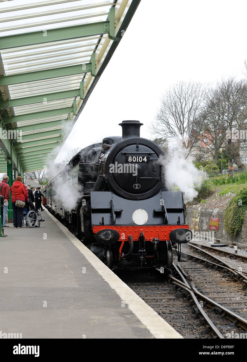 BR Standard Class 4 locomotive No. 80104 arriving a swanage with a service train from Corfe castle Dorset England uk Stock Photo