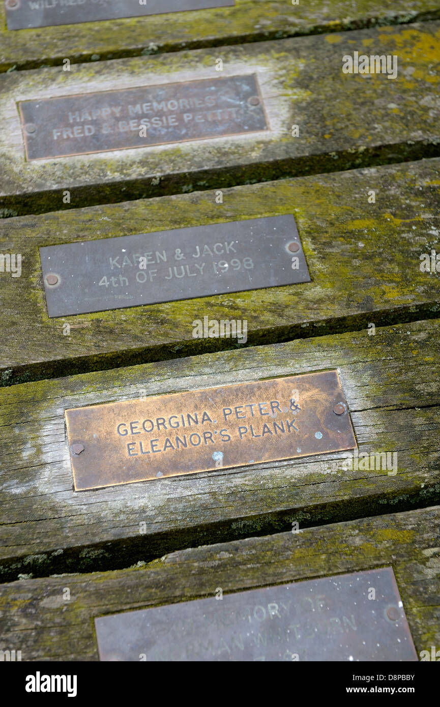 Commemorative named plaques on Swanage pier Dorset England uk Stock Photo