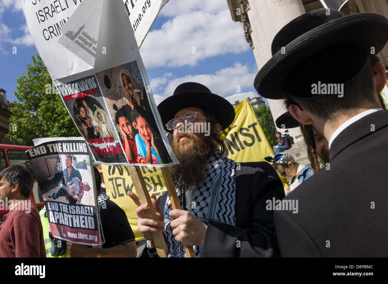 London, UK. 2nd June, 2013. Neturei Karta, Ultra Orthodox Jews, demonstrate alongside the Islamic Human Rights Commissions against Israel at the Closer to Israel 65 celebrating the 65 years of the foundation of the state of Israel in 1948 in Trafalgar Square London. Credit:  Rena Pearl/Alamy Live News Stock Photo