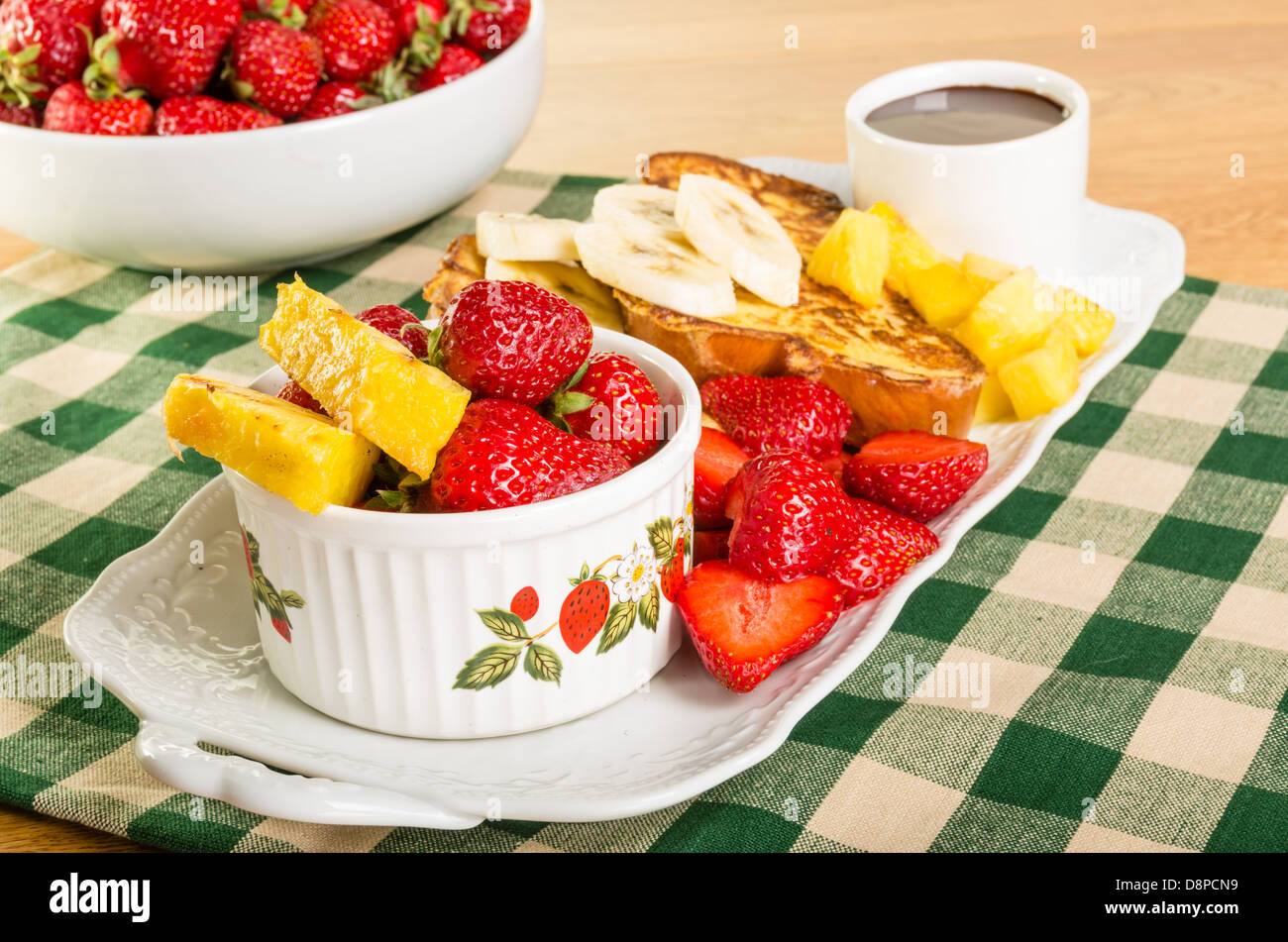 French toast with strawberries pineapple bananas and coffee Stock Photo Alamy