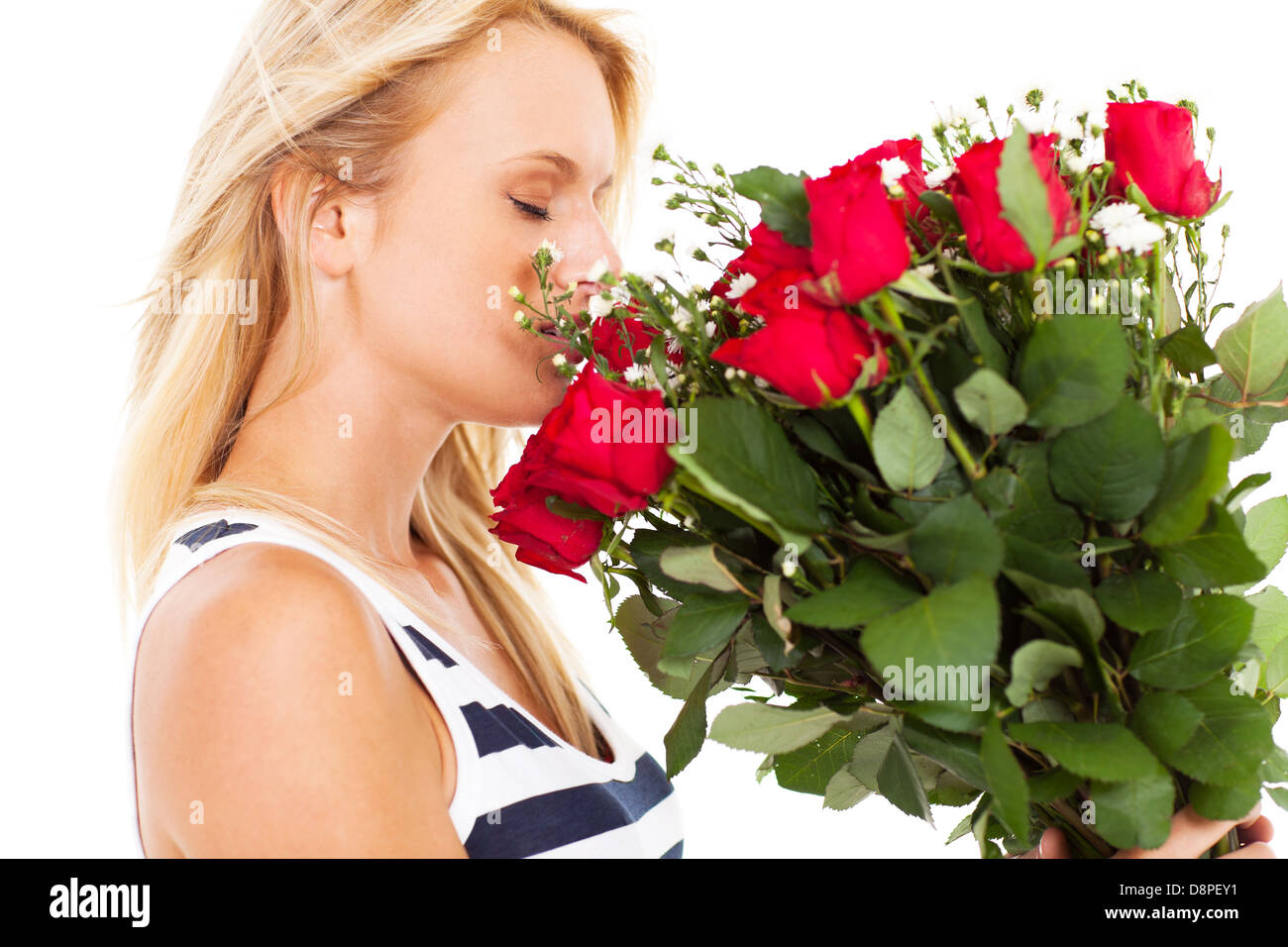 pretty young woman smelling bunch of roses Stock Photo - Alamy