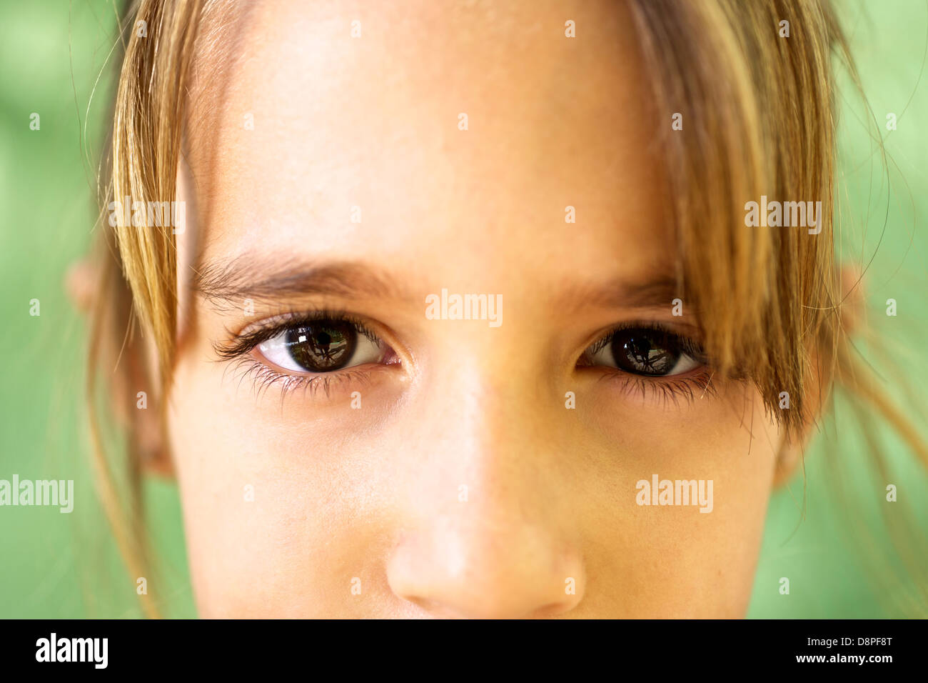 Young people and emotions, portrait of serious girl looking at camera. Closeup of eyes Stock Photo