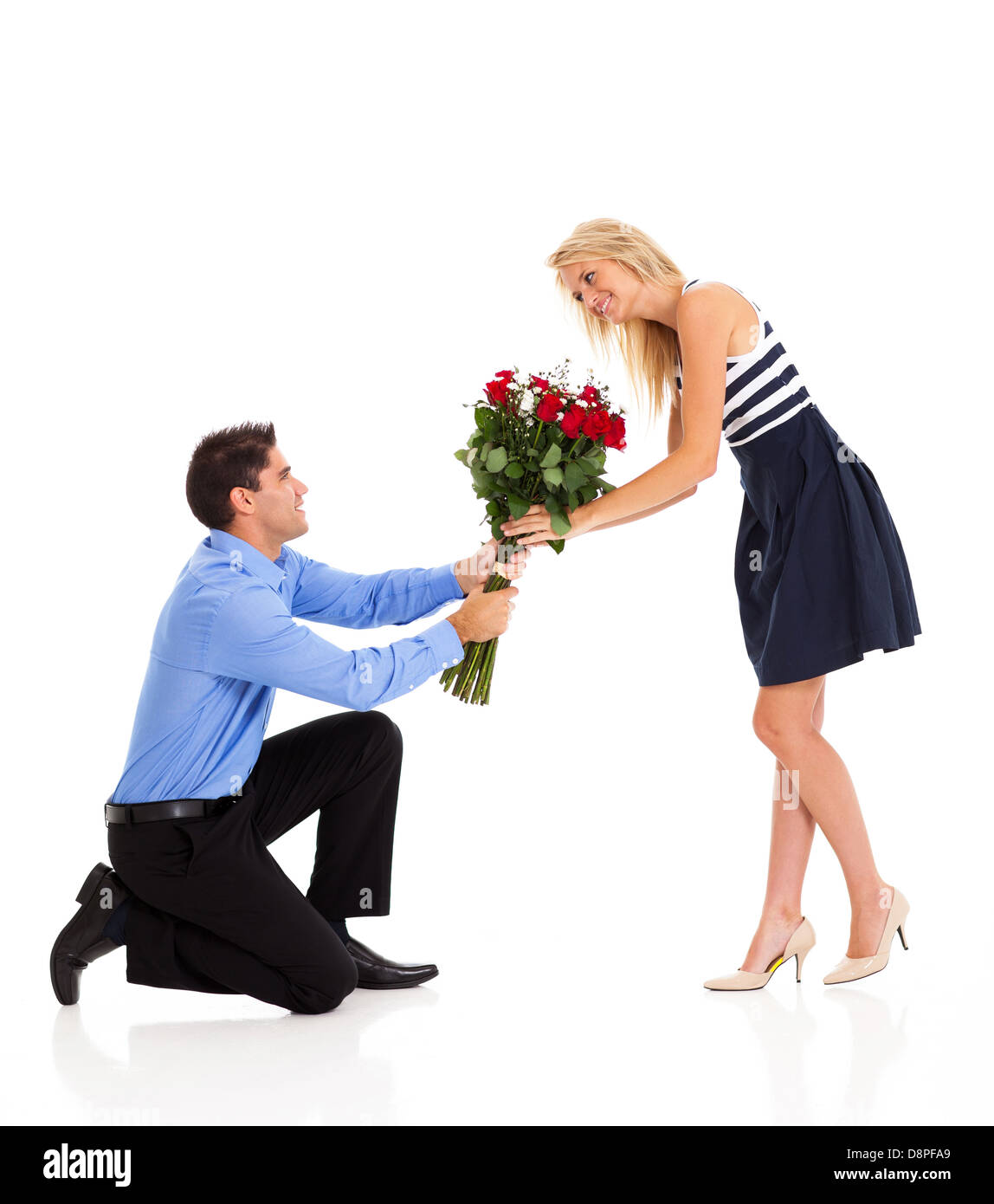 young woman accepting roses from a man on valentine's day Stock Photo