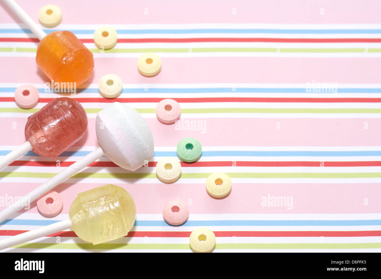 Lollies and sweets on striped background  2 Stock Photo