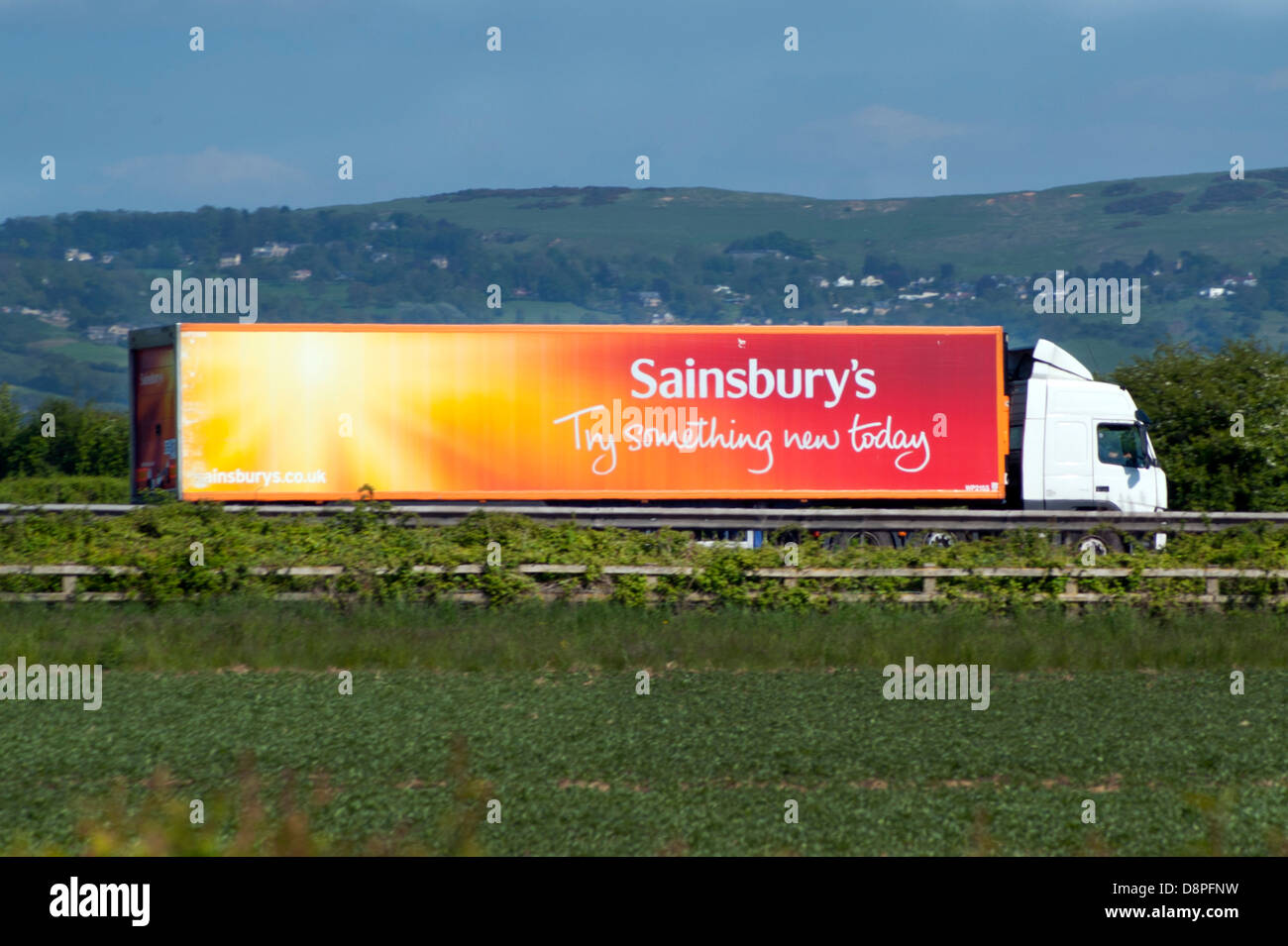 Sainsbury's delivery lorry heading south down M5 motorway in Gloucestershire Stock Photo