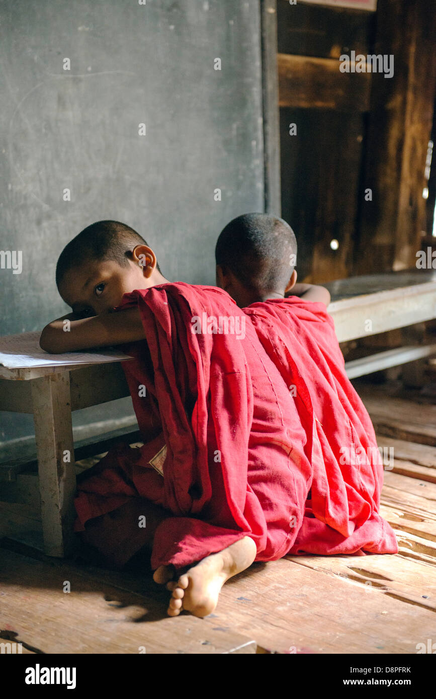 Novice monks studying at monastery near Mandalay Burma Myanmar Stock Photo