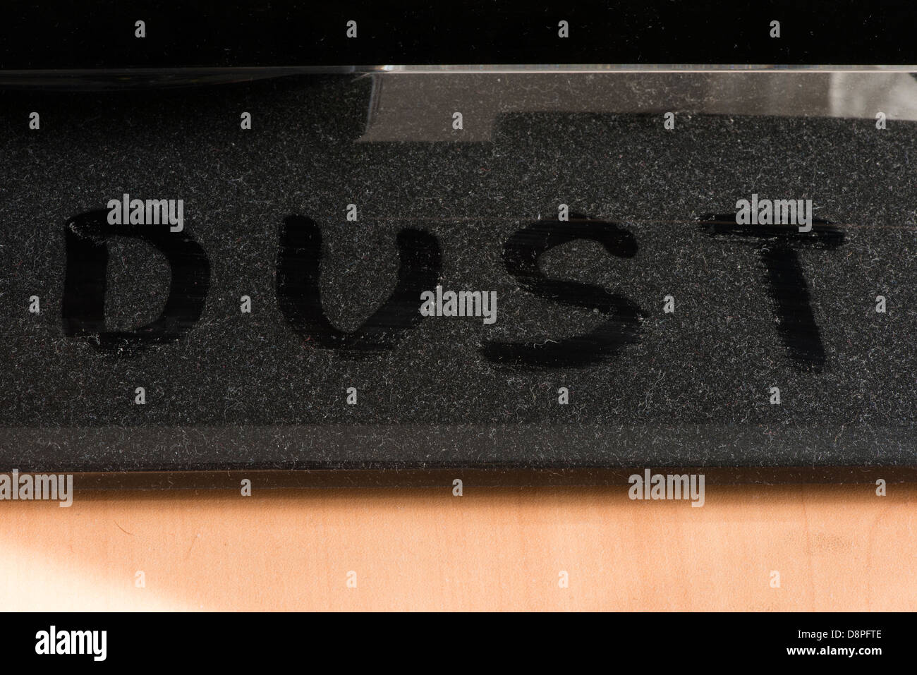 Dust on furniture. Word dust Stock Photo Alamy
