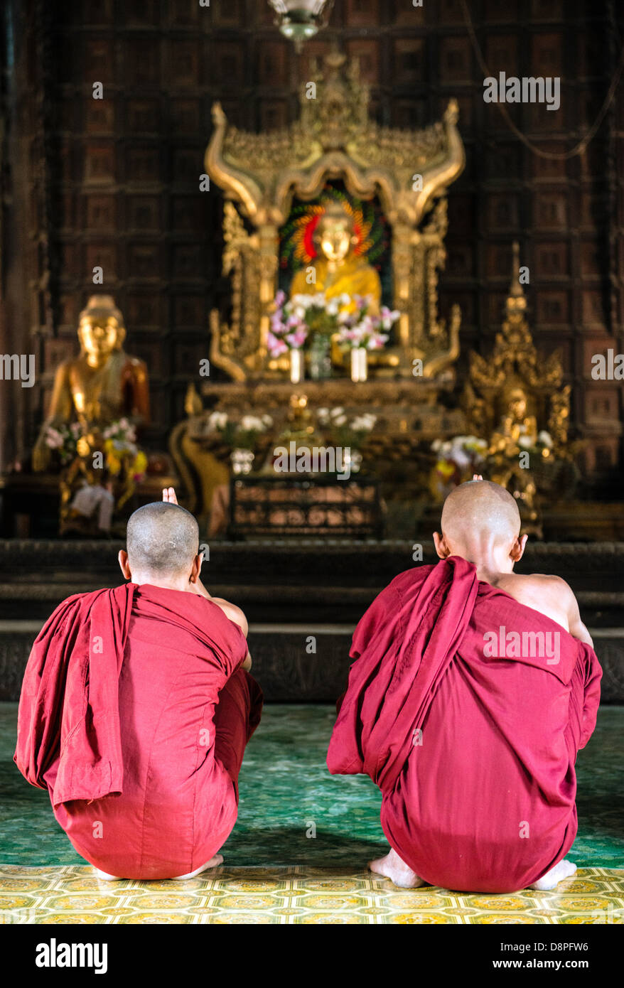 Buddhist monks preying at monastery near Mandalay Burma Myanmar Stock Photo