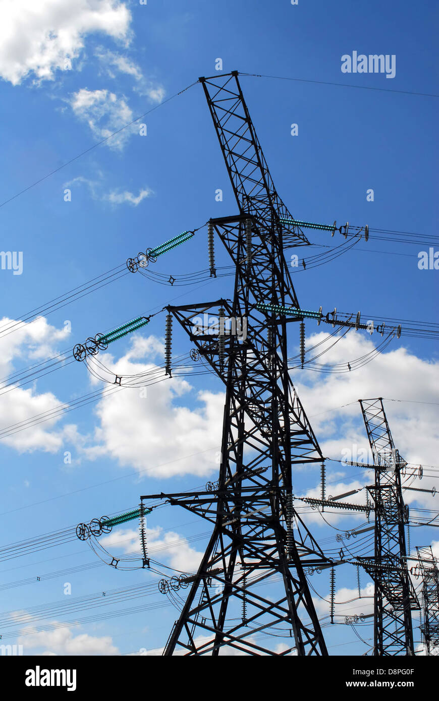 Electrical transmission tower and power lines on cloudy sky Stock Photo ...