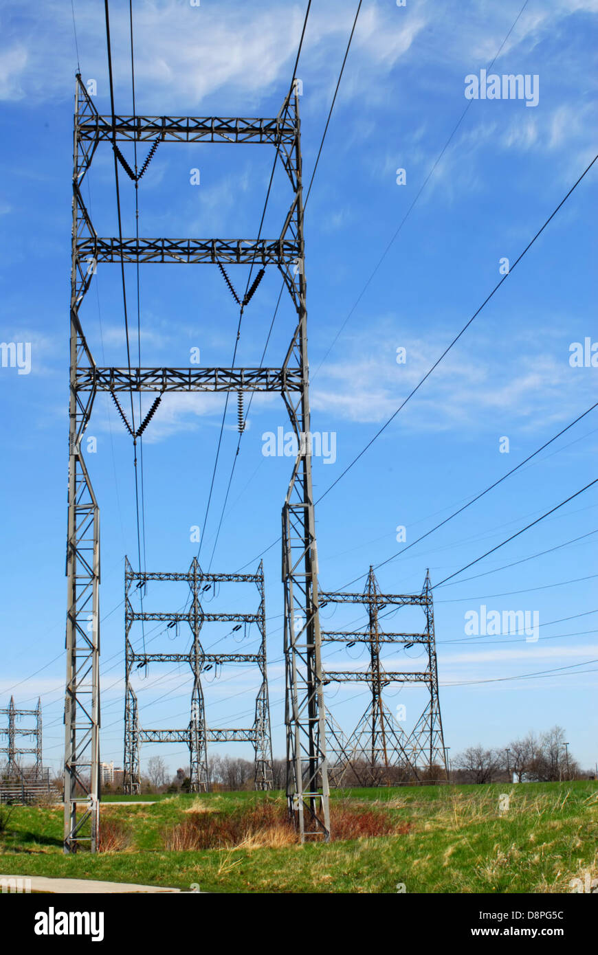 Electrical transmission tower and power lines on cloudy sky Stock Photo ...