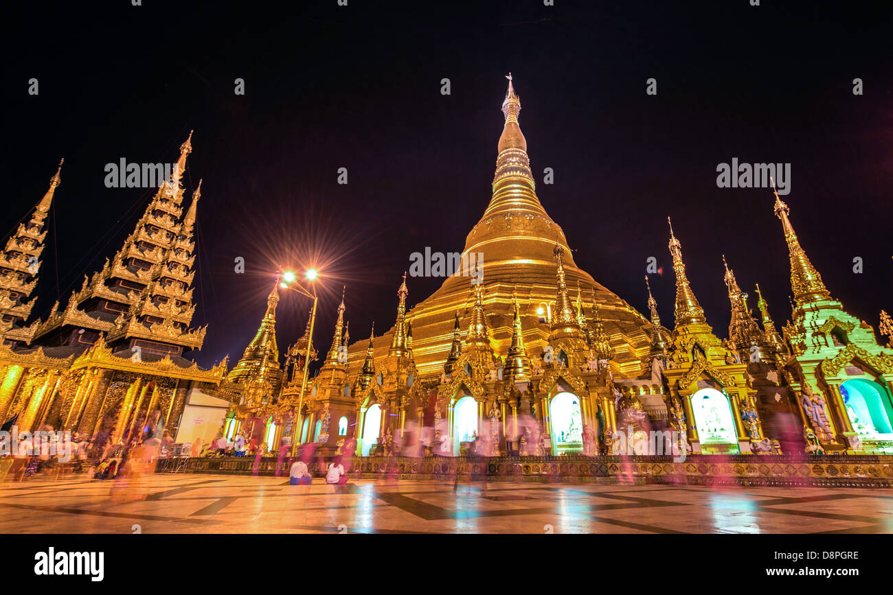 People at night at Shwedagon Pagoda or Great Dagon Pagoda or Golden Pagoda Yangon (Rangoon) Burma Myanmar Stock Photo
