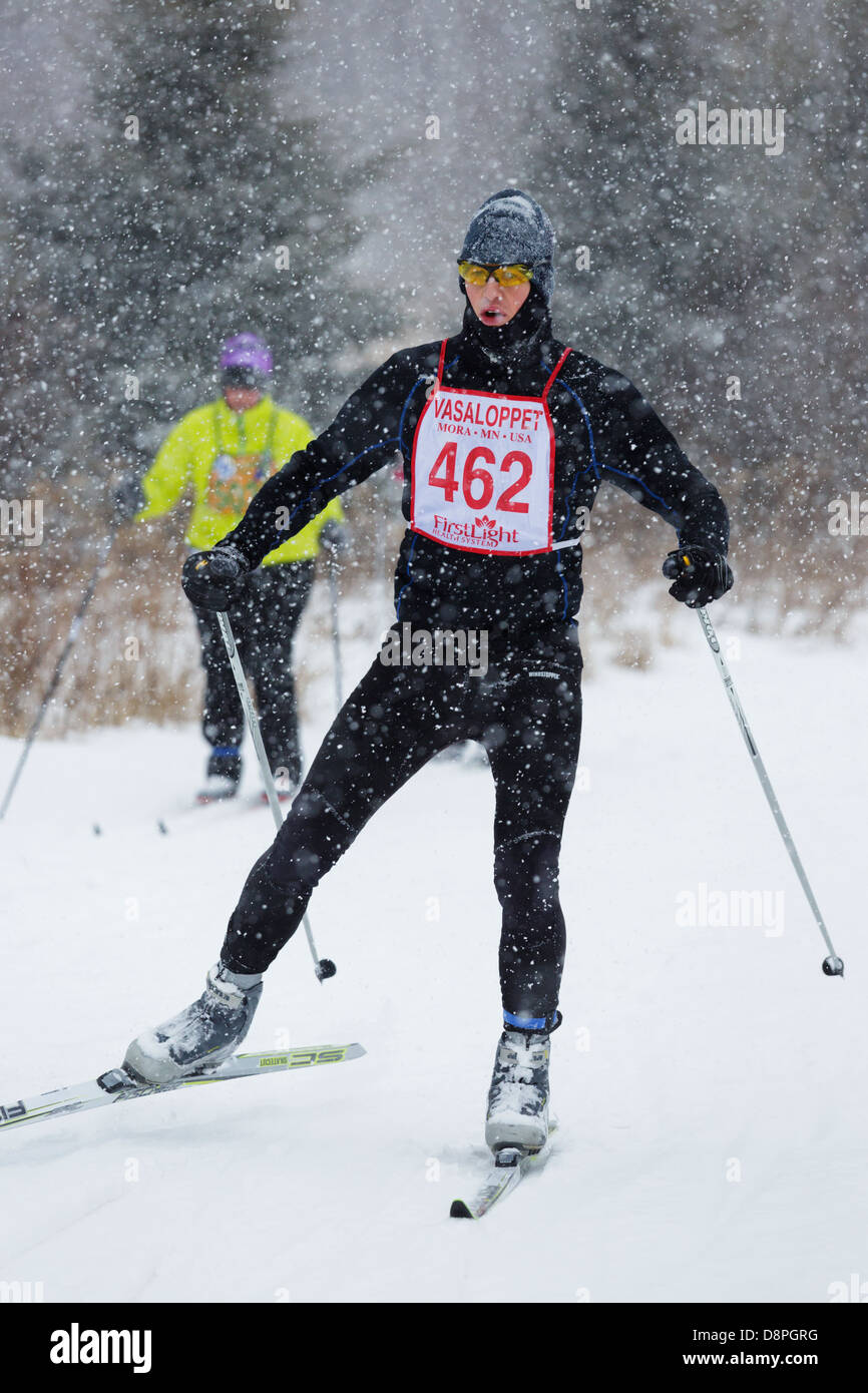 A competitor skis in the Mora Vasaloppet during a snowstorm. Stock Photo