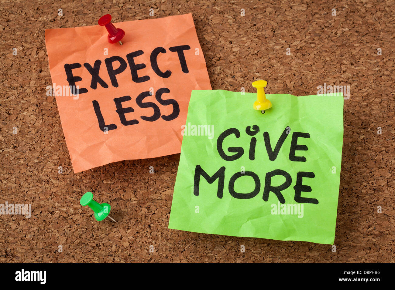 expect less, give more - motivation or self improvement concept - handwriting on colorful sticky notes Stock Photo