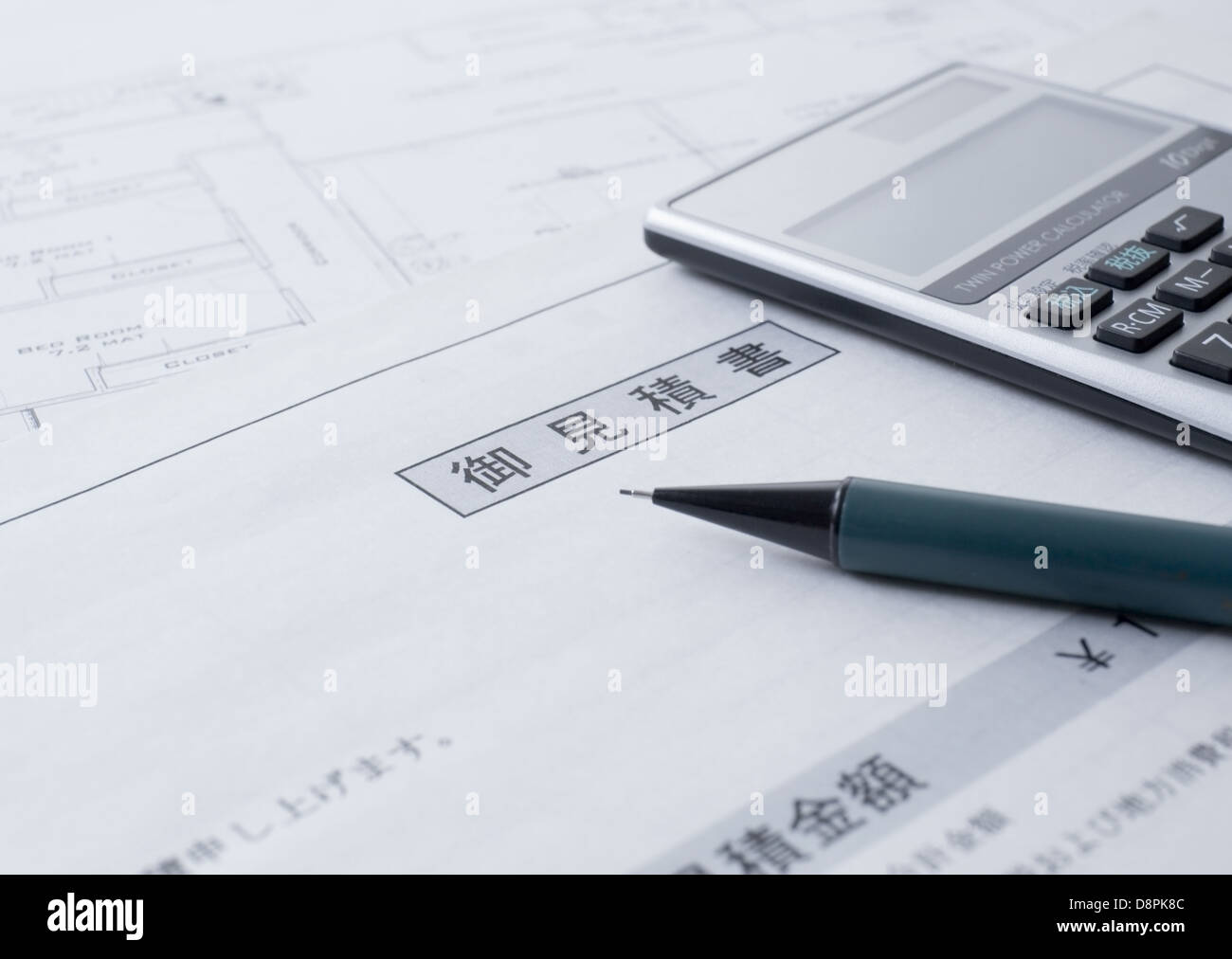 Estimate and a calculator Stock Photo Alamy