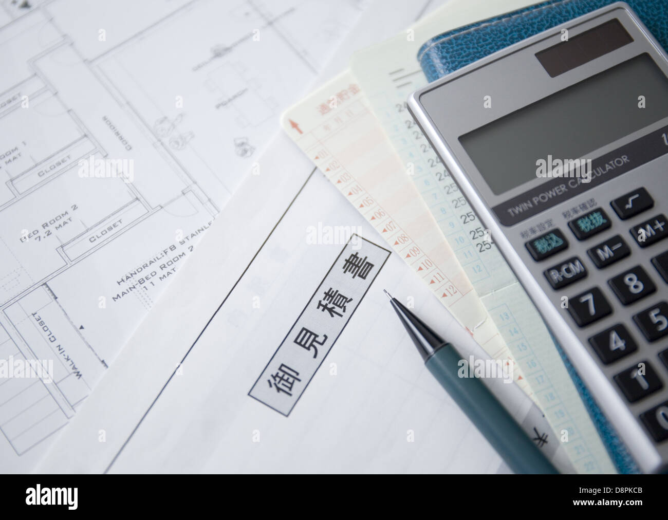 Estimate and a calculator Stock Photo Alamy